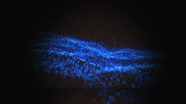 Animation of blue wave of spots on black background