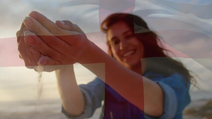 Animation of waving flag of england over woman having fun on the beach - Powered by Adobe