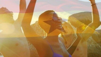 Animation of waving flag of ghana over group of friends having fun on the beach - Powered by Adobe