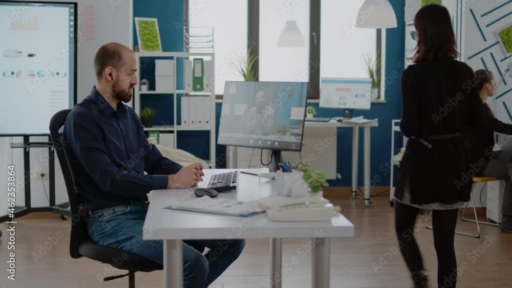 Poster man using video call for meeting with manager on computer. corporate employee talking to trainer on 