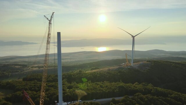 Aerial view overlooking construction of a wind power park - rising, drone shot