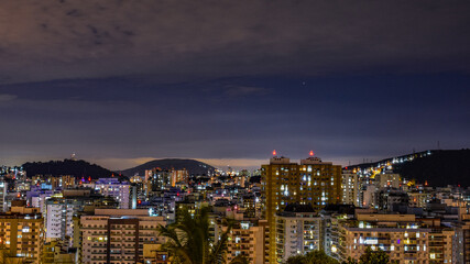 Fototapeta na wymiar Niterói, Rio de Janeiro, Brazil - CIRCA 2021: Long exposure urban night photography with buildings and lights of a Brazilian city