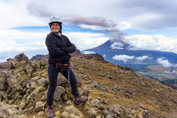 slim girl is standing at top mountain