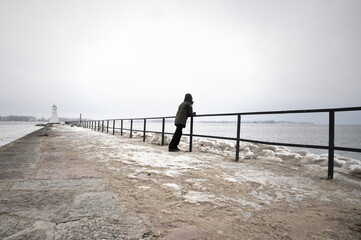 One person in Solitude on a pier