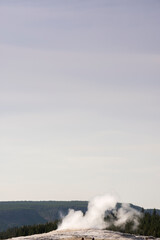 Geyser and hot spring in old faithful basin in Yellowstone National Park in Wyoming
