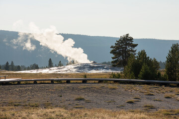 Geyser and hot spring in old faithful basin in Yellowstone National Park in Wyoming