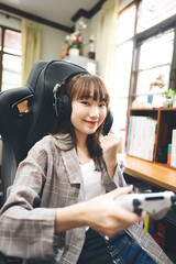 Asian teenager woman stay at home play game and online streaming.