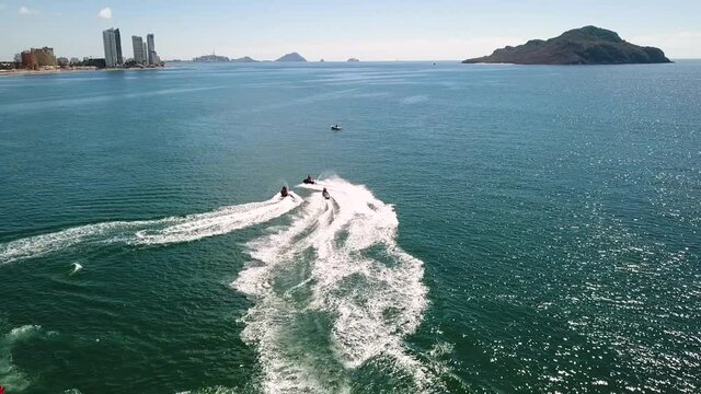 Water scooters sailing around Mazatlan Sinaloa beach in Mexico