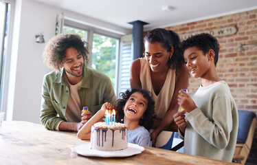 Boy celebrating birthday with family