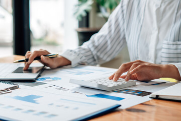 Close up view of bookkeeper or financial inspector hands making report, calculating or checking balance. Home finances, investment, economy, saving money or insurance concept.