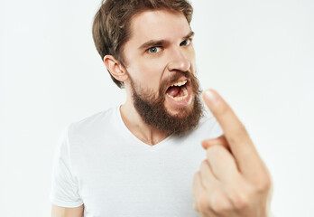 bearded man in a white t-shirt irritated facial expression Studio