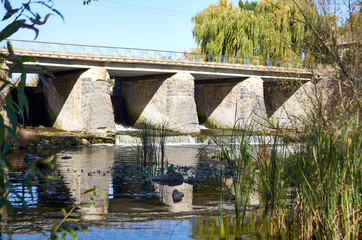 Fototapeta na wymiar Old stone bridge in Dashev Ukraine