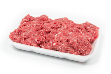 Raw minced meat in a white tray on a white background