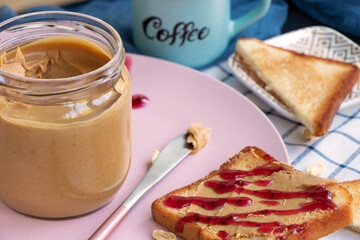 Breakfast on a plate. Toast with peanut butter and berry jam. Toaster bread. fresh sandwich for breakfast. High quality photo