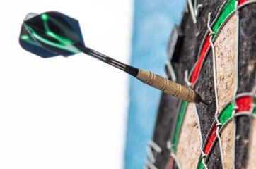 Dart in darts target. Sport