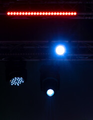 Blue-pink spotlights at a concert at night.