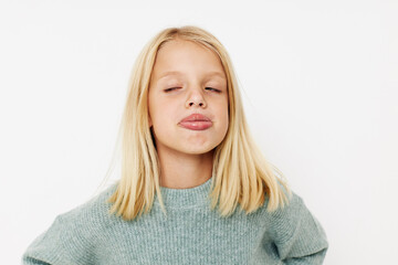 emotional girl with blond hair posing studio