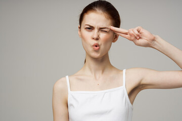 woman in white t-shirt headache health problems stress isolated background