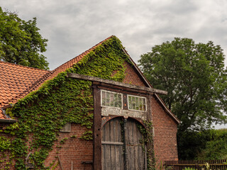 Fototapeta na wymiar old vintage wooden door aganst brick house