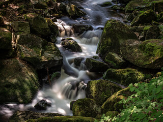 Naklejka na ściany i meble Waterfall on river Ilse in forest Harz, Germany
