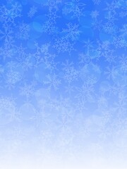 光と雪の結晶の青色の背景