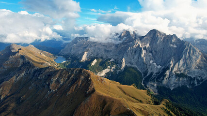 Mountain landscape  with lake and clouds in the Italian Dolomites view from above