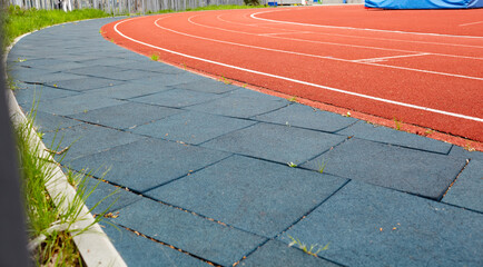 Red treadmill on sport field. Running track on the stadium