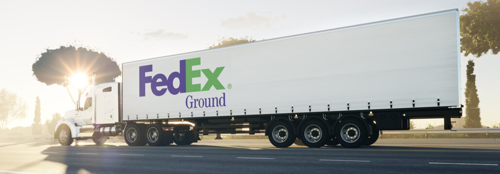 Guilherand-Granges, France - October 12, 2021. Truck on road with FedEx Ground logo.  Subsidiary of the FedEx Corporation which specializes in ground transportation. 3D rendering.