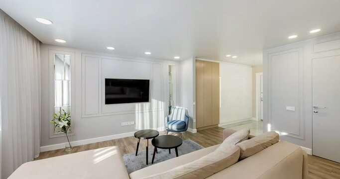 Panorama in interior of modern living room hall with kitchen in modern studio apartments. 