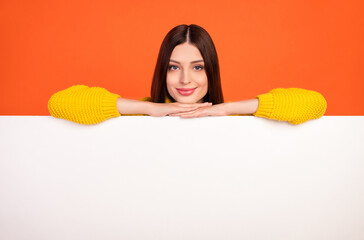 Photo of young woman happy positive smile hands on placard poster advertisement isolated over...