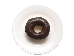 A chocolate glazed donut on small white plate isolated on white background