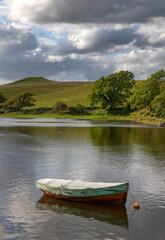 Rowboat. Westport Ireland. Hills and lake. River.