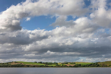 Fototapeta na wymiar River and hills. Westport Ireland westcoast. Clouds.