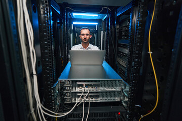 Data center server administrator checking equipment functionalities