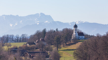 Panorama with Zugspitze mountain and church St. Johann Baptist (near Holzhausen, Lake Starnberg).