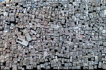 Old letterpress metal type for typesetting in a tray on a market stall