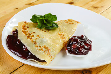 Delicous pancake with fruit jam