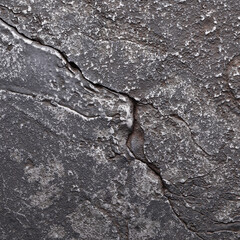 eroded texture steel or another alloy. metal background with cracks and scratches