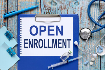 Open Enrollment. ampoules, tablets. stethoscope, notepad on the doctor's table. Medical diagnosis or doctor's prescription mockup. medicine concept