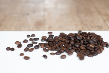Roasted coffee beans on white background.
