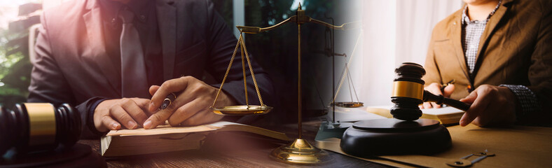 Justice and law concept.Male judge in a courtroom with the gavel, working with, computer and...