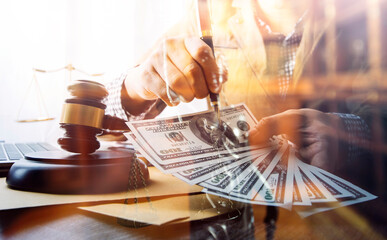 Male lawyer working with contract papers and wooden gavel on tabel in courtroom. justice and law ,attorney, court judge, concept.