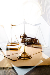 Business and lawyers discussing contract papers with brass scale on desk in office. Law, legal services, advice, justice and law concept picture with film grain effect