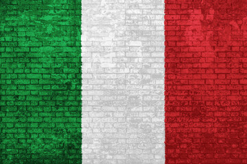 wall of bricks painted with the flag of Italy, green white and red colors. 3D background. Concept of social barriers of immigration, divisions, and political conflicts in Italy.