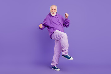 Fototapeta na wymiar Full length body size view of attractive cheerful grey-haired man dancing clubbing isolated over bright violet purple color background