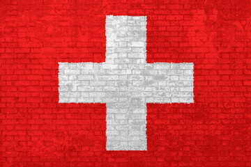 Wall of bricks painted with the national Switzerland flag in 3D background. Concept of social barriers of immigration, divisions, and political conflicts in Switzerland.