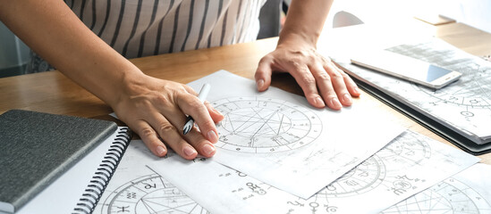 Astrology. Astrologer calculates a natal chart and makes a forecast of fate