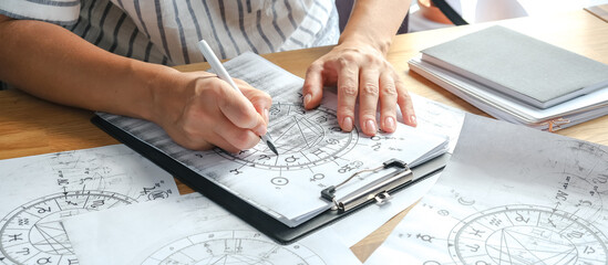 Astrology. Astrologer calculates a natal chart and makes a forecast of fate