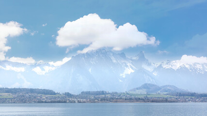Obraz premium The landscape of mountain lake in Swiss Alps. Breathtaking Scene. Panoramic view of beautiful mountain landscape in Alps background