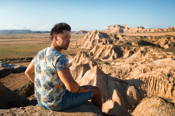 Fototapeta premium Young caucasian man at Bardenas Reales, Navarra, Basque Country.